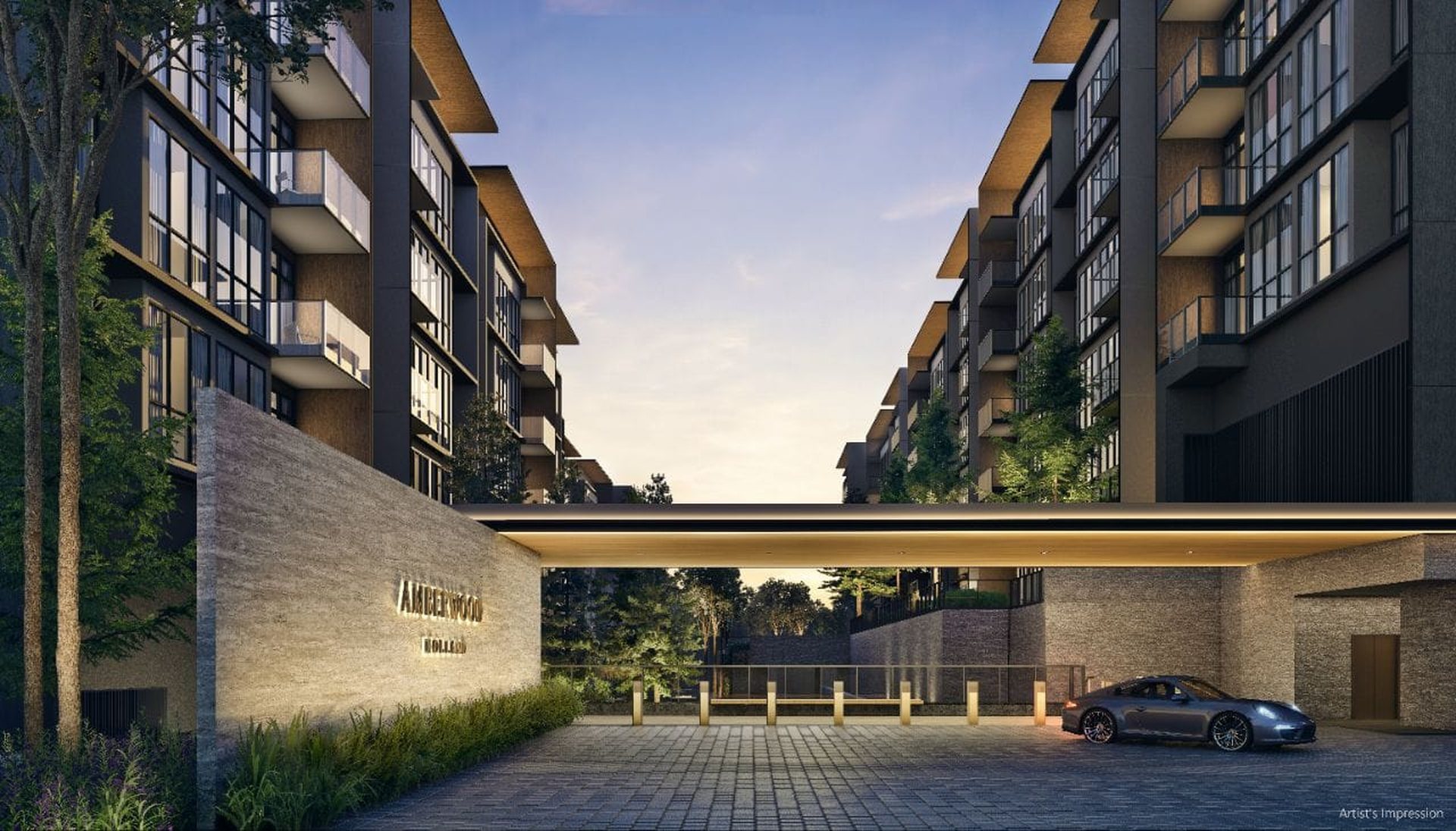 Arrival court of Amberwood at Holland at dusk, with a stone feature wall and low-rise blocks